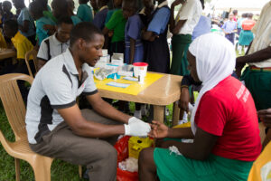 Health worker administers a test for HIV